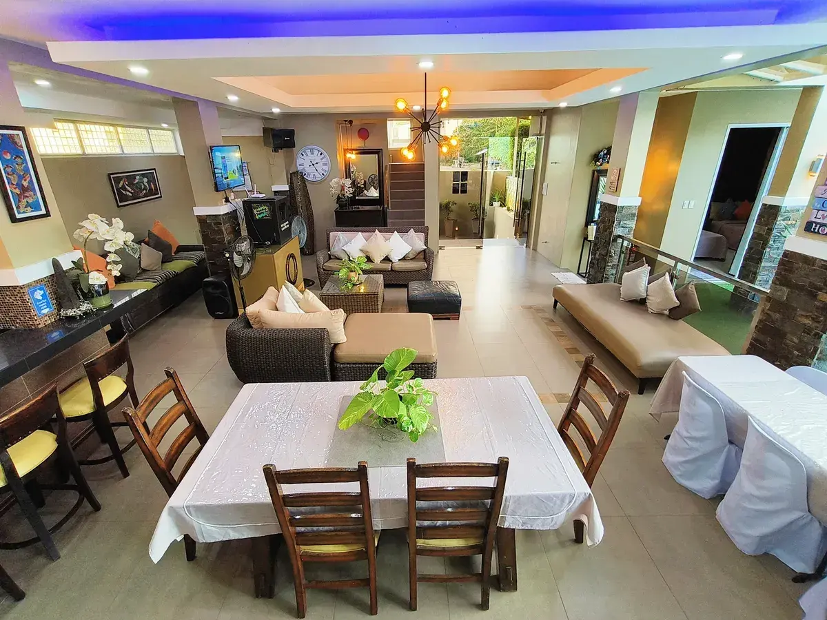 The kitchen bar and dining tables in the pavilion