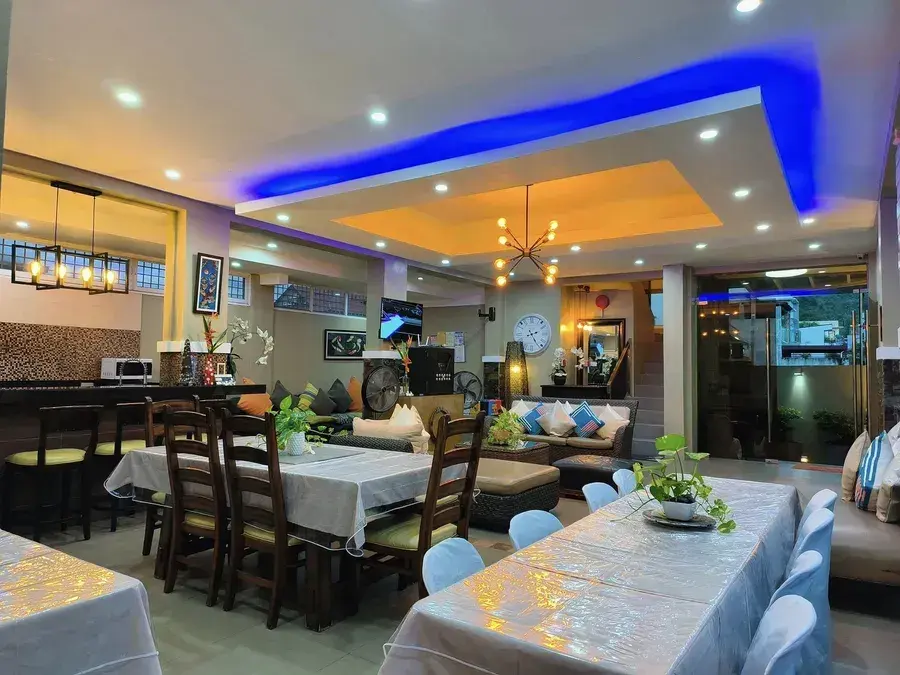 The kitchen bar, lounge and long dining tables