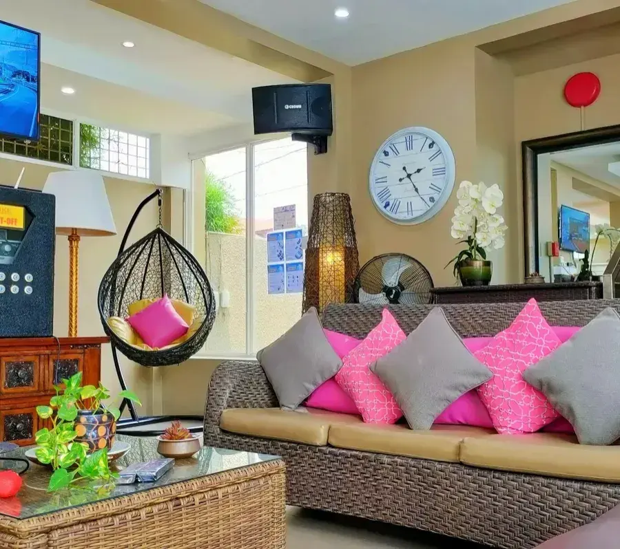The videoke corner with sofa and hanging egg chair